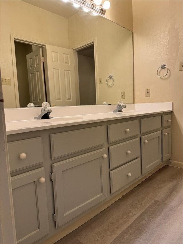 400 Nagle St Unit 304, College Station, TX 77840 - bathroom featuring double vanity and wood finished floors