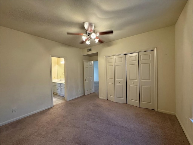 400 Nagle St Unit 304, College Station, TX 77840 - unfurnished bedroom featuring light colored carpet, a closet, ensuite bathroom, and a ceiling fan