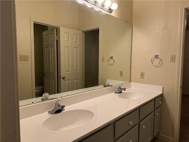 400 Nagle St Unit 304, College Station, TX 77840 - bathroom featuring toilet and double vanity