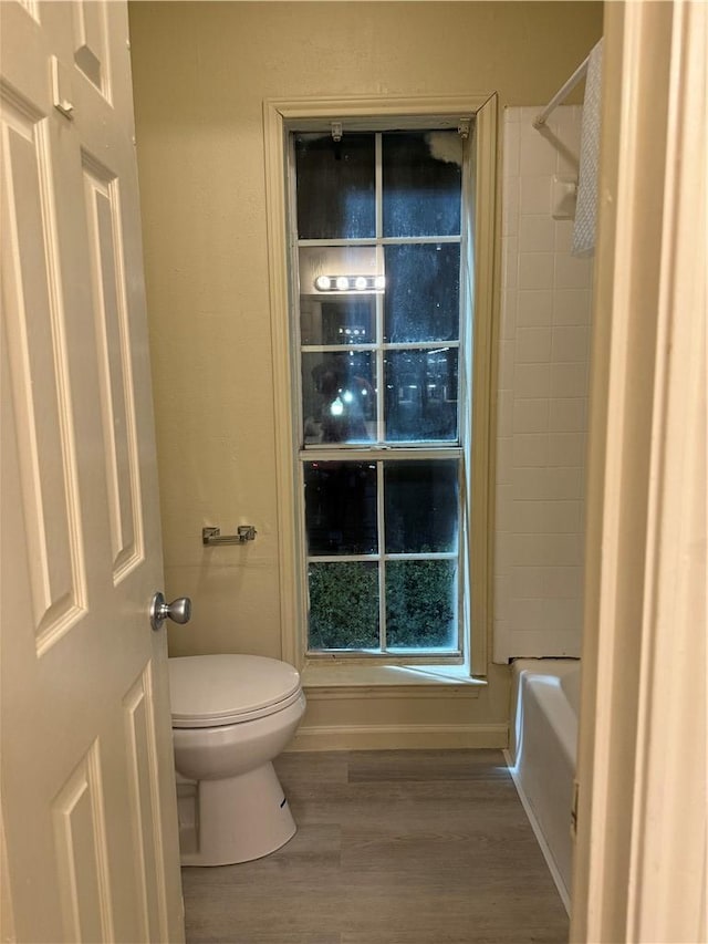 400 Nagle St Unit 304, College Station, TX 77840 - bathroom featuring wood finished floors and shower / bath combination