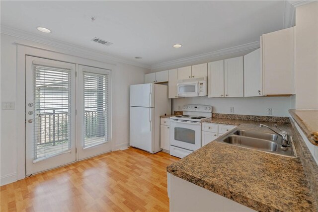 kitchen featuring white appliances, ornamental molding, sink, and white cabinets