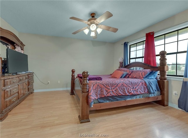 bedroom featuring ceiling fan and light hardwood / wood-style floors