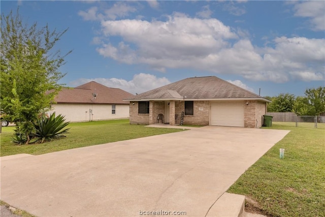 view of front of home featuring a garage and a front lawn