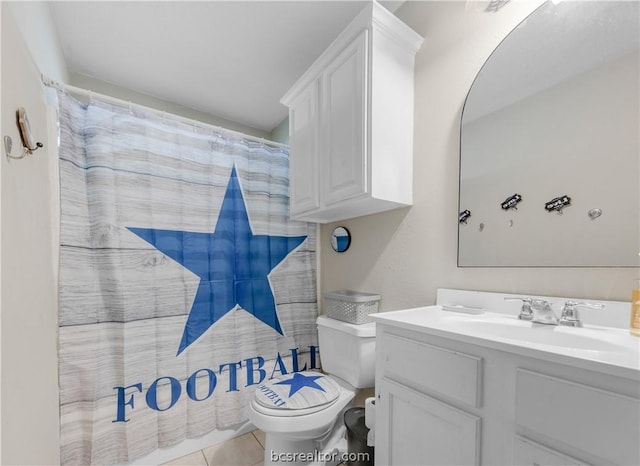 bathroom with walk in shower, tile patterned flooring, vanity, and toilet