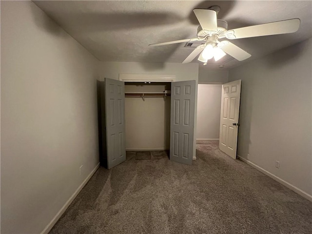 unfurnished bedroom featuring carpet, a closet, and ceiling fan