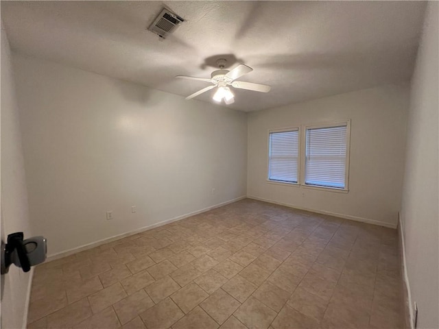 unfurnished room with ceiling fan