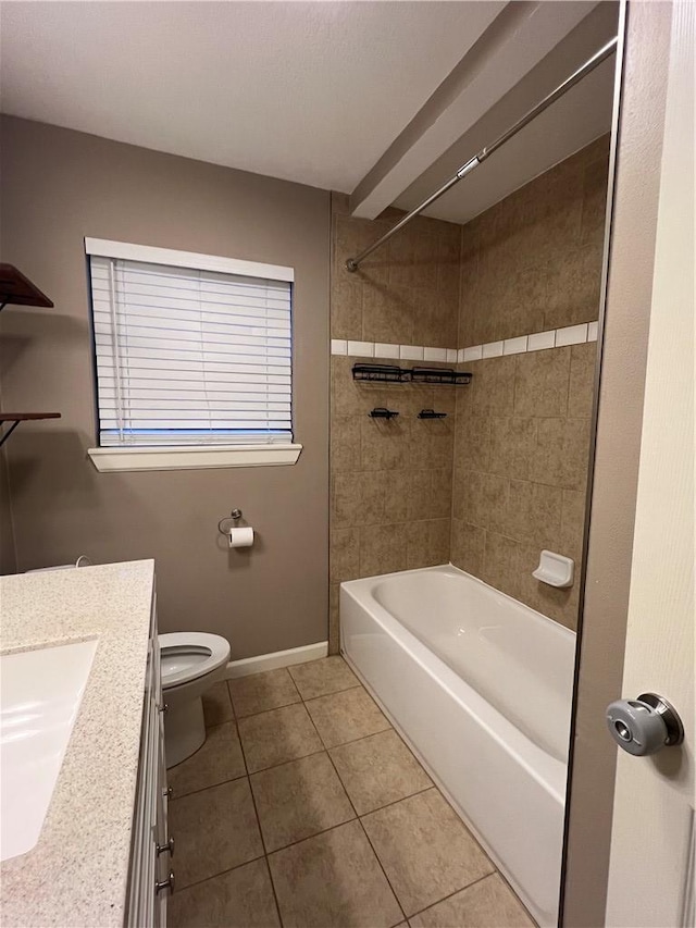 full bathroom featuring tiled shower / bath, tile patterned flooring, vanity, and toilet