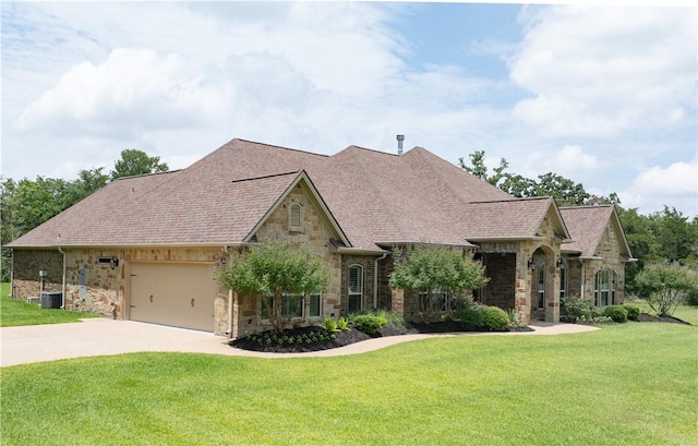 4018 Arboleda Dr, College Station, TX 77845 - view of front of property with stone siding, concrete driveway, and a front lawn