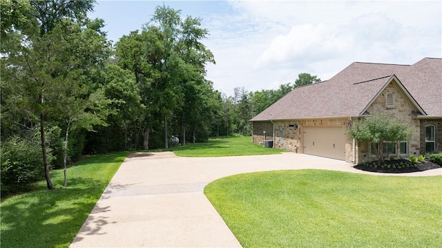 4018 Arboleda Dr, College Station, TX 77845 - view of home's community with concrete driveway, a lawn, and a garage