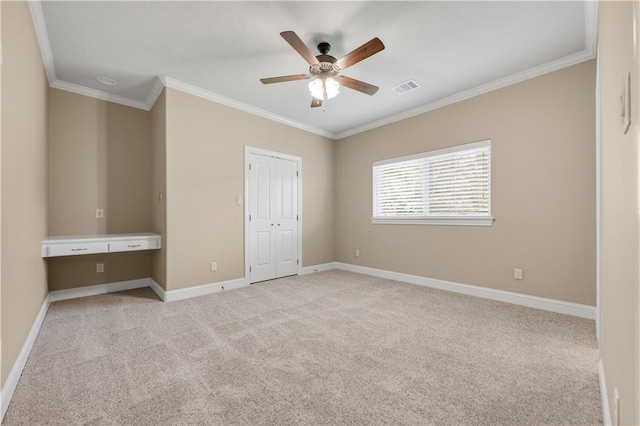 4018 Arboleda Dr, College Station, TX 77845 - unfurnished bedroom with ornamental molding, light carpet, baseboards, a closet, and a ceiling fan
