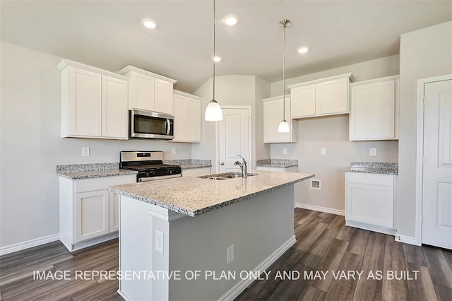 kitchen featuring decorative light fixtures, an island with sink, white cabinetry, appliances with stainless steel finishes, and sink