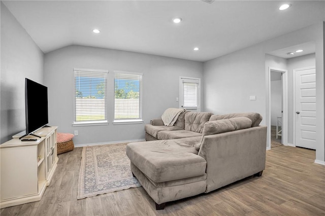 1147 Buffalograss Trl, Sealy, TX 77474 - living room with light wood finished floors, recessed lighting, baseboards, and lofted ceiling