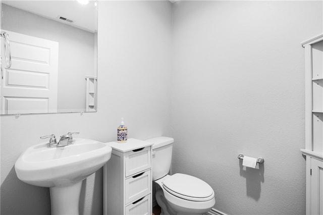 1147 Buffalograss Trl, Sealy, TX 77474 - half bathroom with toilet and a sink