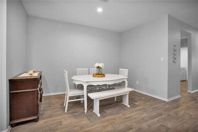1147 Buffalograss Trl, Sealy, TX 77474 - dining area with wood finished floors, baseboards, and recessed lighting