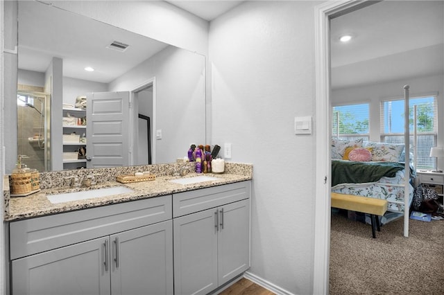 1147 Buffalograss Trl, Sealy, TX 77474 - ensuite bathroom with vanity, an enclosed shower, and recessed lighting