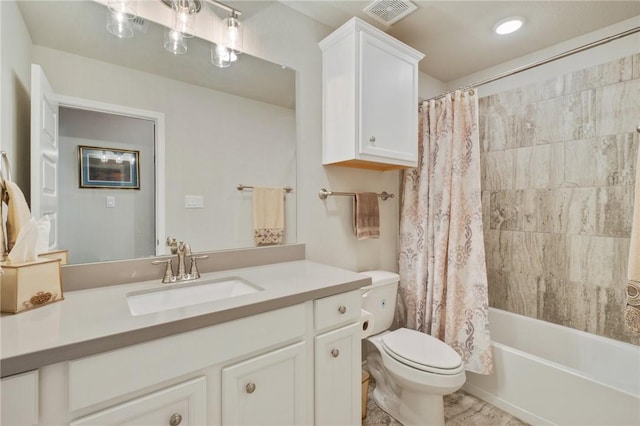 full bathroom featuring vanity, toilet, and shower / tub combo with curtain