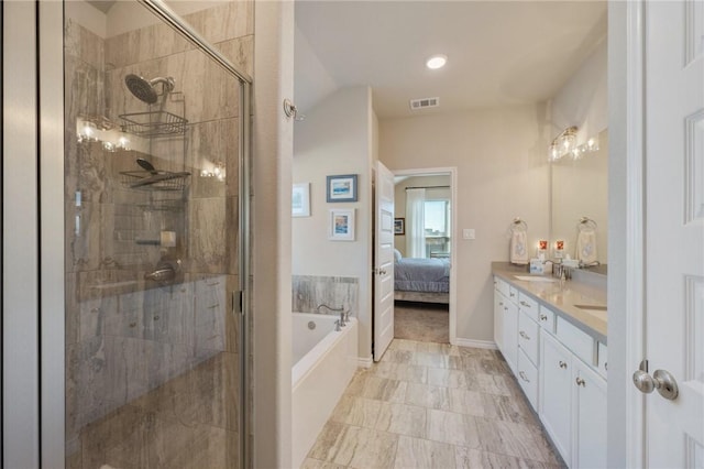 bathroom featuring vanity and shower with separate bathtub