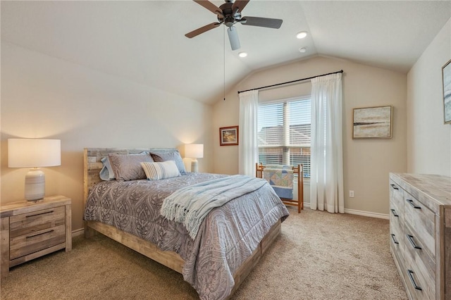 bedroom featuring vaulted ceiling, light carpet, and ceiling fan