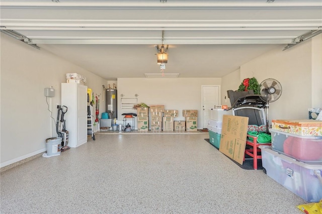 garage with a garage door opener and water heater