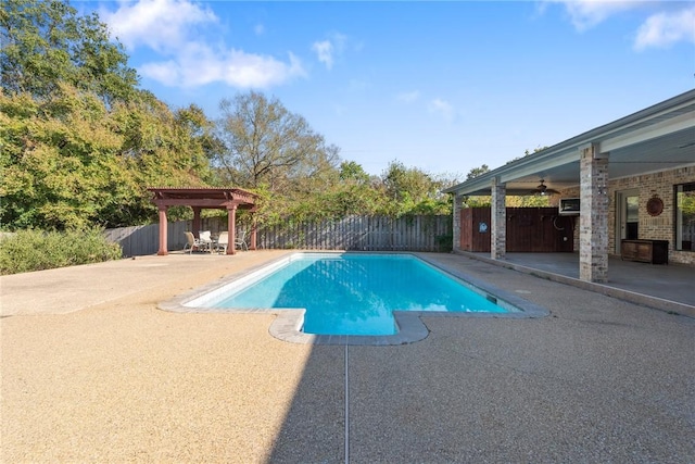 view of swimming pool featuring ceiling fan and a patio area