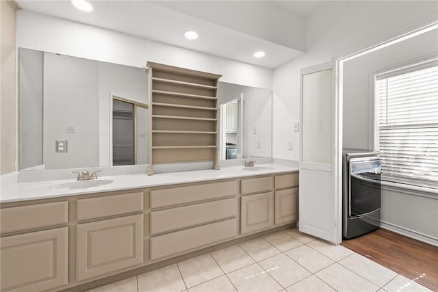 bathroom with tile patterned floors and vanity