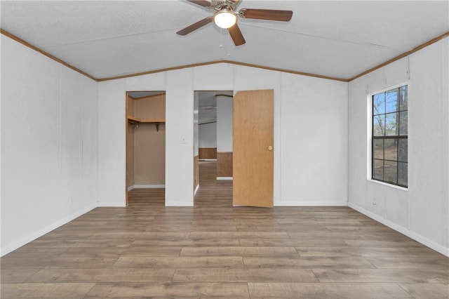 SPLITA4794 Tall Pine Rd, Navasota, TX 77868 - unfurnished bedroom with lofted ceiling, wood finished floors, crown molding, and a ceiling fan
