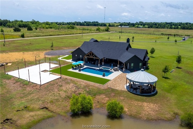 exterior space featuring a gazebo, a patio area, and a rural view