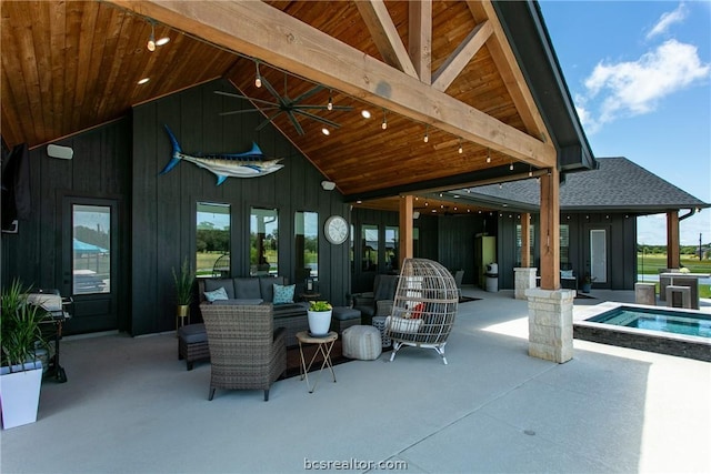 view of patio / terrace with an outdoor hangout area and a pool with hot tub