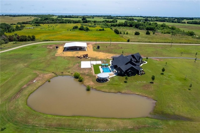 birds eye view of property featuring a water view and a rural view