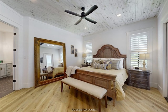 bedroom with light hardwood / wood-style floors and ceiling fan