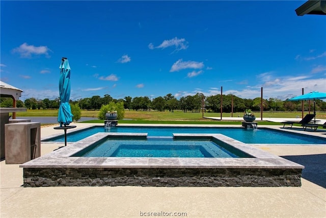 view of swimming pool with a yard and an in ground hot tub