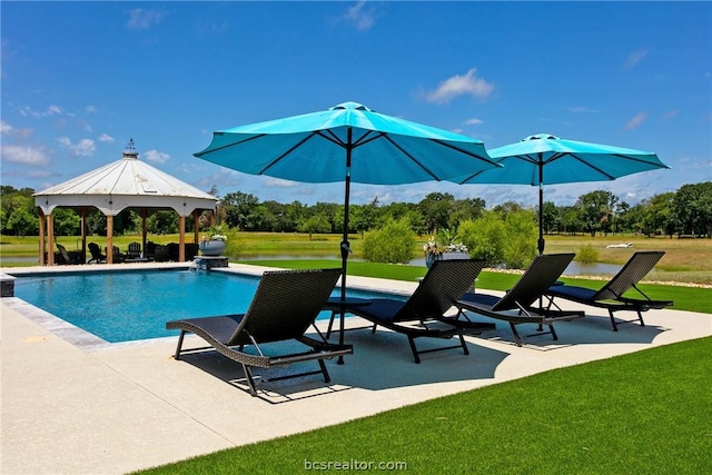 view of pool with a gazebo, a patio, a water view, and a lawn