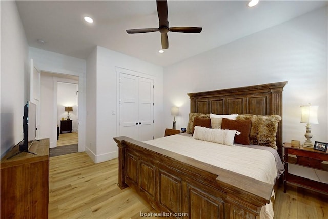 bedroom featuring ceiling fan and light hardwood / wood-style flooring