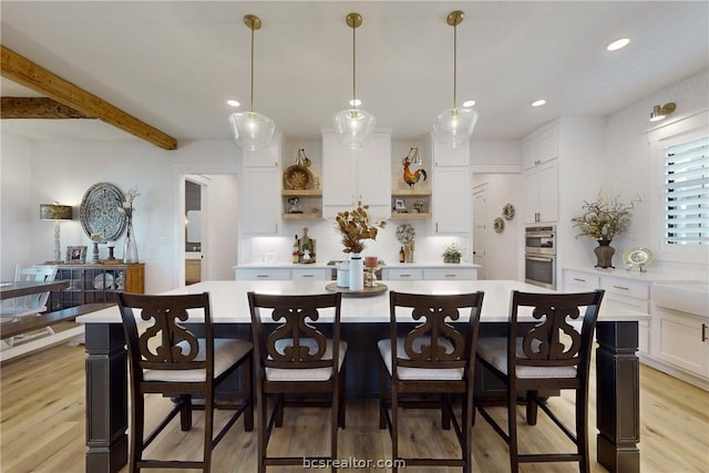 dining space featuring light wood-type flooring