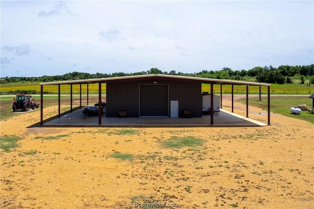 view of outbuilding with a rural view