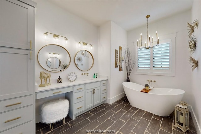 bathroom with wood-type flooring, vanity, a bathtub, and a notable chandelier