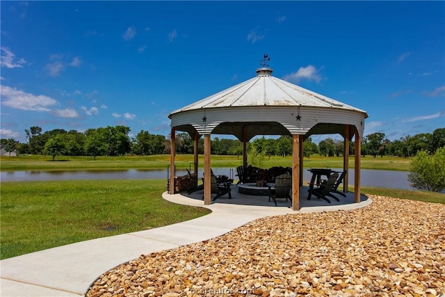 view of community with a gazebo, a water view, a yard, and a patio