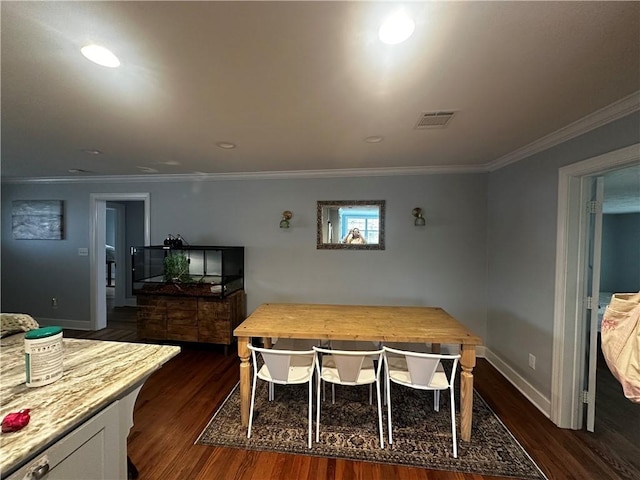 306 Timber St, College Station, TX 77840 - dining room with dark wood-type flooring, ornamental molding, and baseboards