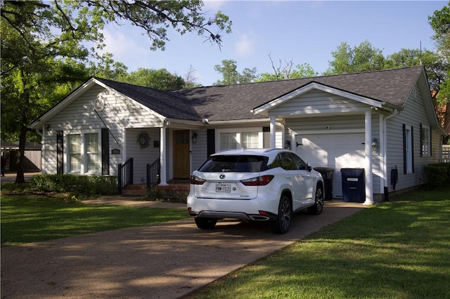 306 Timber St, College Station, TX 77840 - single story home featuring an attached garage, driveway, a front yard, and a shingled roof