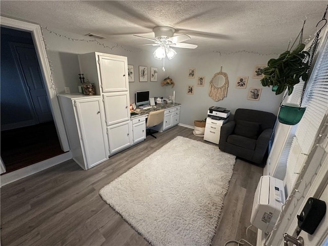 306 Timber St, College Station, TX 77840 - living area with wood finished floors, ceiling fan, a textured ceiling, an office area, and baseboards