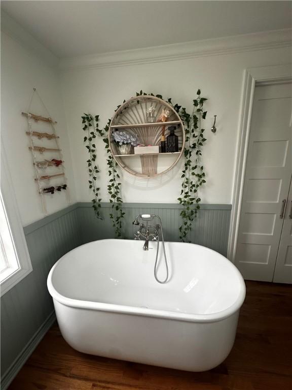 306 Timber St, College Station, TX 77840 - full bath featuring a wainscoted wall, a freestanding tub, wood finished floors, and crown molding