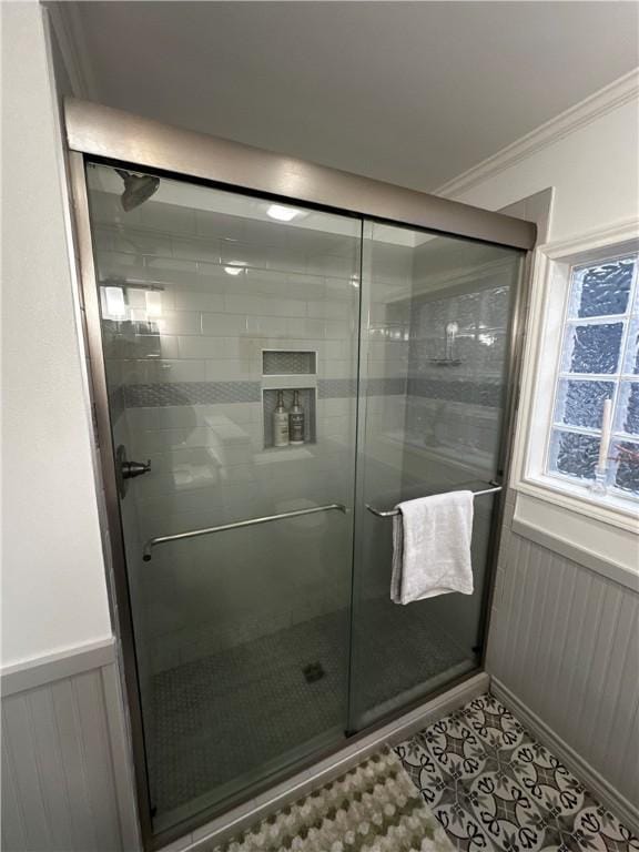 306 Timber St, College Station, TX 77840 - bathroom featuring a stall shower, ornamental molding, tile patterned floors, and wainscoting