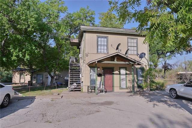 view of front of home featuring stairs