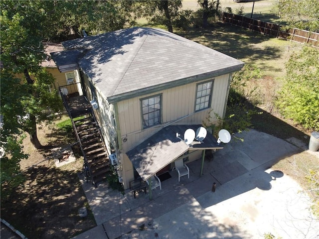 exterior space with fence and stairway