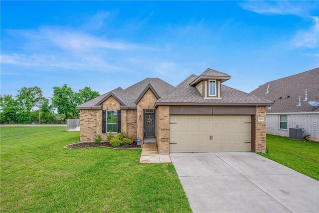 view of front of home with driveway, central AC unit, a garage, brick siding, and a front lawn