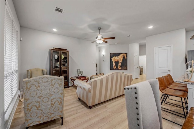 living room featuring visible vents, recessed lighting, light wood-style flooring, and ceiling fan