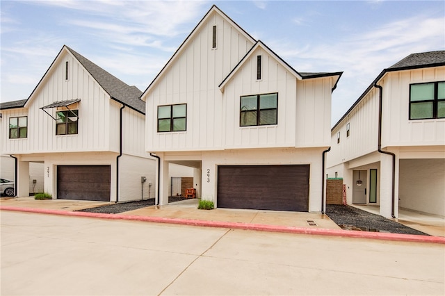 293 Estates Cir, College Station, TX 77840 - modern farmhouse style home with a garage, board and batten siding, and concrete driveway