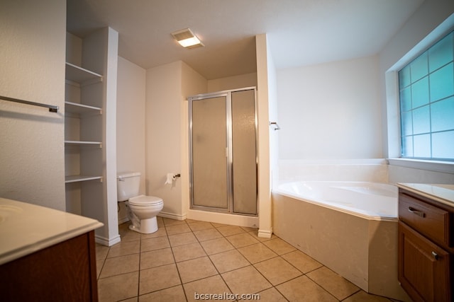 full bathroom featuring tile patterned flooring, vanity, separate shower and tub, and toilet