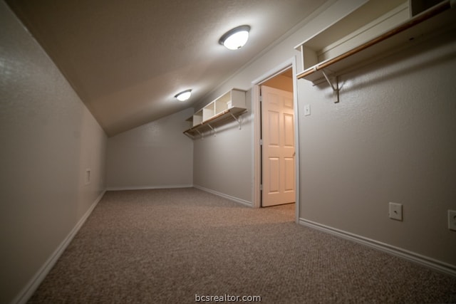 bonus room with carpet flooring and lofted ceiling