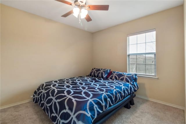 bedroom with light colored carpet and ceiling fan